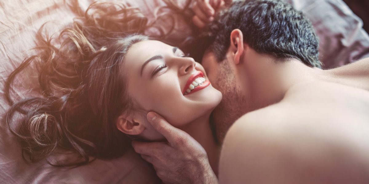 Couple having sex on bed